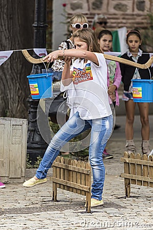 Traditional competition with yoke and 2 buckets in Plovdiv, Bulgaria Editorial Stock Photo
