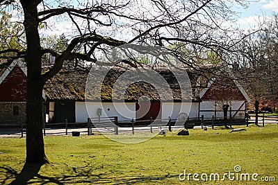 Old farmhouse with green roof Stock Photo