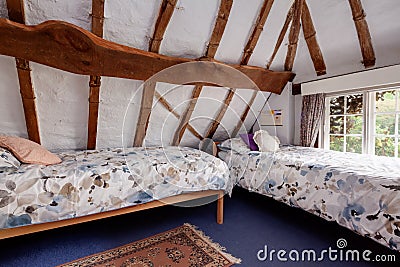 Traditional cottage attic bedroom Editorial Stock Photo