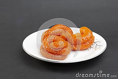 Traditional crispy fun sweet found in Bangladeshi mela. ingridients are Rice powder, sugar,color. Rice Jilabi. Stock Photo