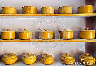 Traditional crockery, bowls made of yellow sandstone Stock Photo