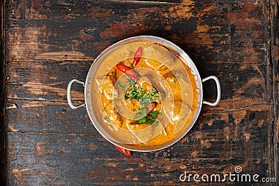 Traditional curry on wooden background Stock Photo