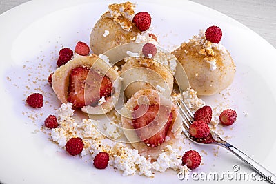 Traditional Czech strawberry quark dumplings with melted butter Stock Photo