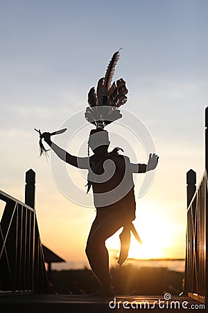 Traditional Dancer While Dancing In The Sunset Stock Photo