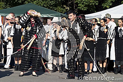 Traditional dancers at a festival on Muzeul Taranului Editorial Stock Photo