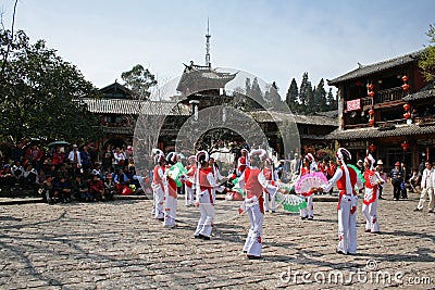 Traditional dancers from a minority group perform in Lijiang Old Town Editorial Stock Photo