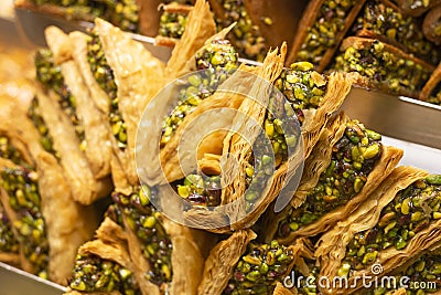 Traditional delicious turkish dessert baklava in the shop window showcase. Different kinds of turkish delights. Popular Stock Photo