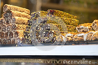 Traditional delicious turkish desserts in the shop window showcase. Different kinds of turkish delights. Popular Stock Photo