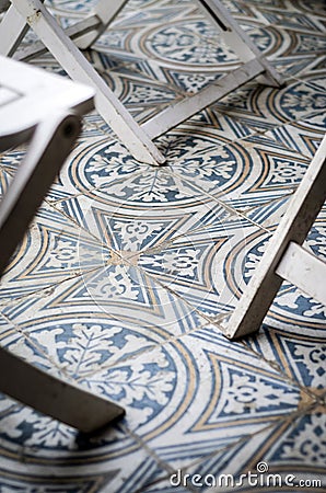 Traditional design old rustic floor tiles detail in spanish cafe Stock Photo