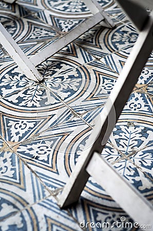Traditional design old rustic floor tiles detail in spanish cafe Stock Photo
