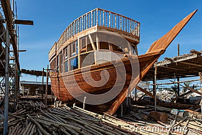 Traditional dhow under construction in wharf in Sur, Oman Stock Photo