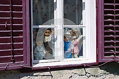 Traditional dolls in the window or romanian cottage Editorial Stock Photo