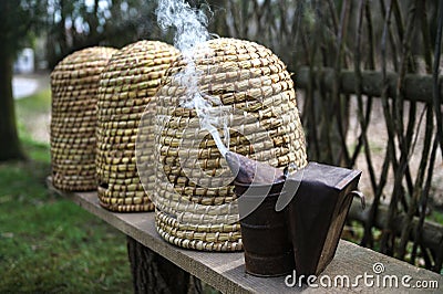 An ancient apiary with traditional straw hives Stock Photo