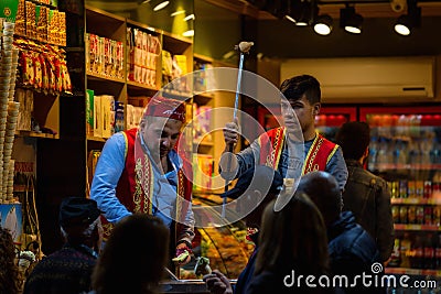 Traditional Dondurma ice-cream sellers in Istanbul, Turkey. Night scene. Tourist attraction Editorial Stock Photo