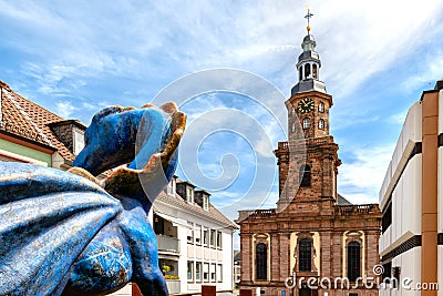 Traditional Dragon at the Schlossplatz in Worms. In background the Dreifaltigkeitskirche Editorial Stock Photo