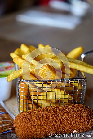 Traditional Dutch fast food snacks, fricandel and french fried potato chips Stock Photo