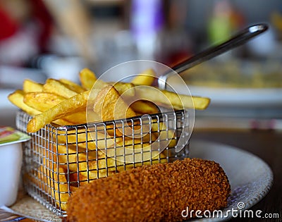 Traditional Dutch fast food snacks, fricandel and french fried potato chips Stock Photo