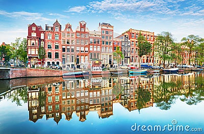 Traditional Dutch old houses on canals in Amsterdam, Netherland Editorial Stock Photo