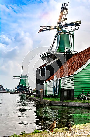Traditional Dutch old wooden windmill in Zaanse Schans Stock Photo