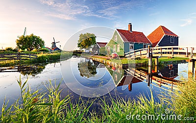 Traditional dutch windmill near the canal. Netherlands, Landcape at sunset Stock Photo