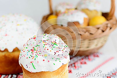 Traditional easter cake kulich Ukrainian style with colored eggs on painted towel Stock Photo