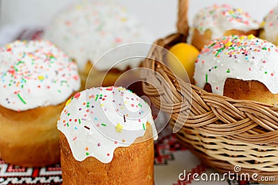 Traditional easter cake kulich Ukrainian style with colored eggs on painted towel Stock Photo