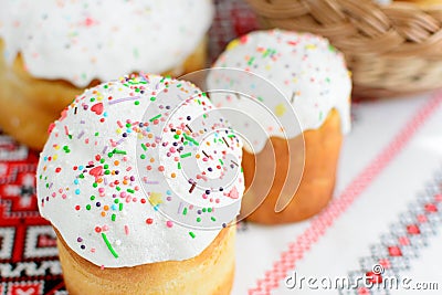 Traditional easter cake kulich Ukrainian style with colored eggs on painted towel Stock Photo