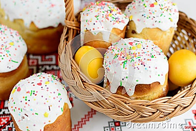 Traditional easter cake kulich Ukrainian style with colored eggs on painted towel Stock Photo