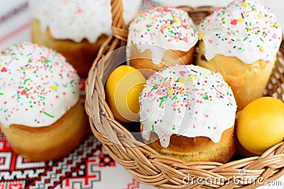 Traditional easter cake kulich Ukrainian style with colored eggs on painted towel Stock Photo