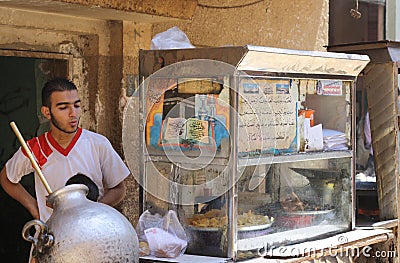 Traditional Egyptian foul Arabic food street vendor Editorial Stock Photo