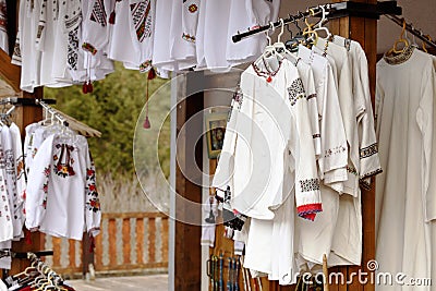 Traditional embroidered romanian blouses exposed for sale Stock Photo