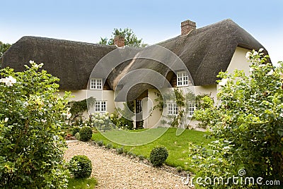 Traditional English thatched country cottage Stock Photo