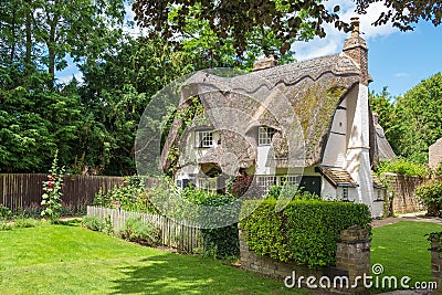 Traditional English, thatched roof cottages seen in a very well maintained condition. Editorial Stock Photo