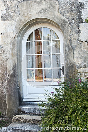 Traditional entrance with a wooden and glass door Stock Photo