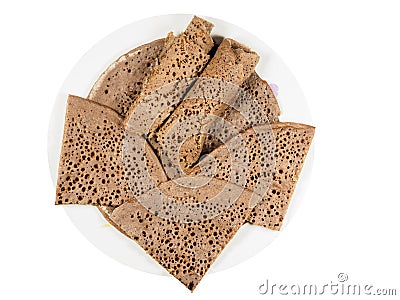 Traditional Ethiopian flatbread from fermented teff flour on a w Stock Photo
