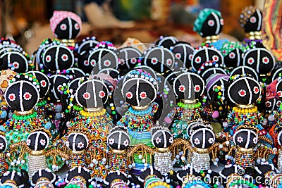 Traditional ethnic African handmade dolls with multicolored bead decoration at local market in Cape Town, South Africa Stock Photo