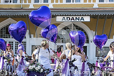 Traditional Fancy Women Bike Riders with purple balloons on 'Fancy Women Bike Ride' event Editorial Stock Photo