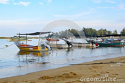 traditional fisherman boat moored over beautiful sea view and sandy beach under bright sunny day Editorial Stock Photo