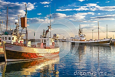 Traditional fisherman boats in Iceland at sunset Stock Photo