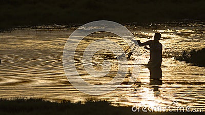 Traditional fisherman throwing a net in Sri Lanka Editorial Stock Photo