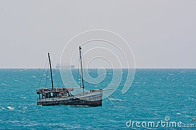 A traditional fishermen boat fixed in the water Editorial Stock Photo