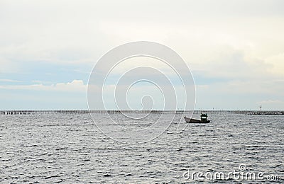 Traditional fishing boat floating in the sea Stock Photo