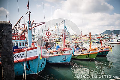 Traditional fishing boats dock at Bang Saray Pier, Sattahip District, Thailand Editorial Stock Photo