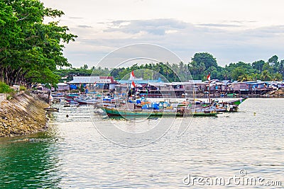 Traditional fishing boats parked behind the fishing village Editorial Stock Photo