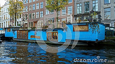 Traditional Floating boat house in Amsterdam canals, the Netherlands, October 13, 2017 Editorial Stock Photo