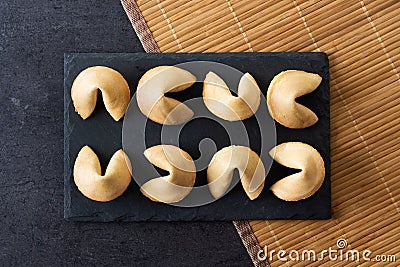 Traditional fortune cookies black slate background Stock Photo