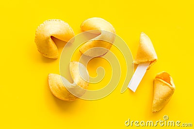 Traditional fortune cookies on yellow table top-down Stock Photo