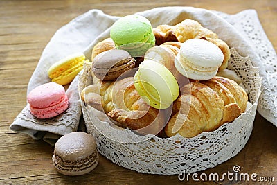 Traditional French pastries croissants and macaroons Stock Photo