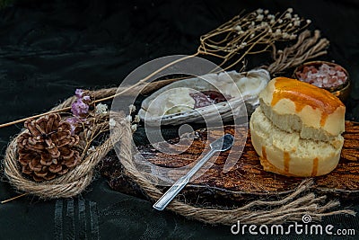 Scones on the wooden tray served with Homemade raspberry jam and Mascarpone cheese on Shell Stock Photo