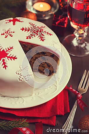 Traditional fruitcake on Christmas table Stock Photo